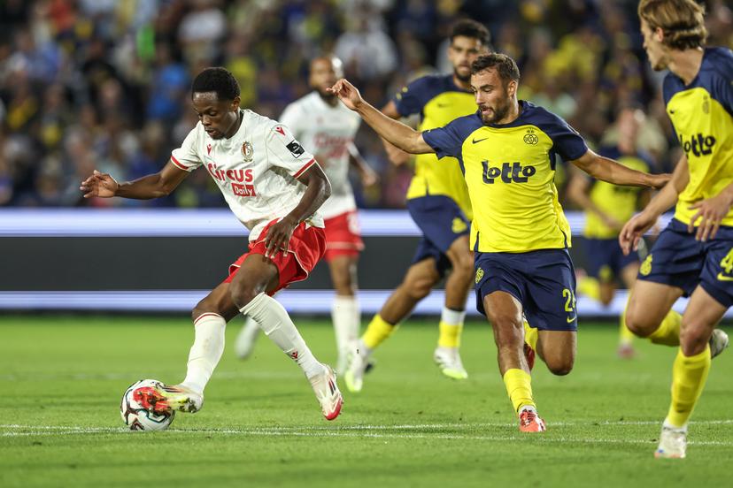 Standard's Rafiki Said and Union's Charles Vanhoutte fight for the ball during a soccer match between Royale Union Saint-Gilloise and Standard de Liege, Saturday 16 August 2025 in Brussels, on day 4 of the 2025-2026 'Jupiler Pro League' first division of the Belgian championship. BELGA PHOTO BRUNO FAHY