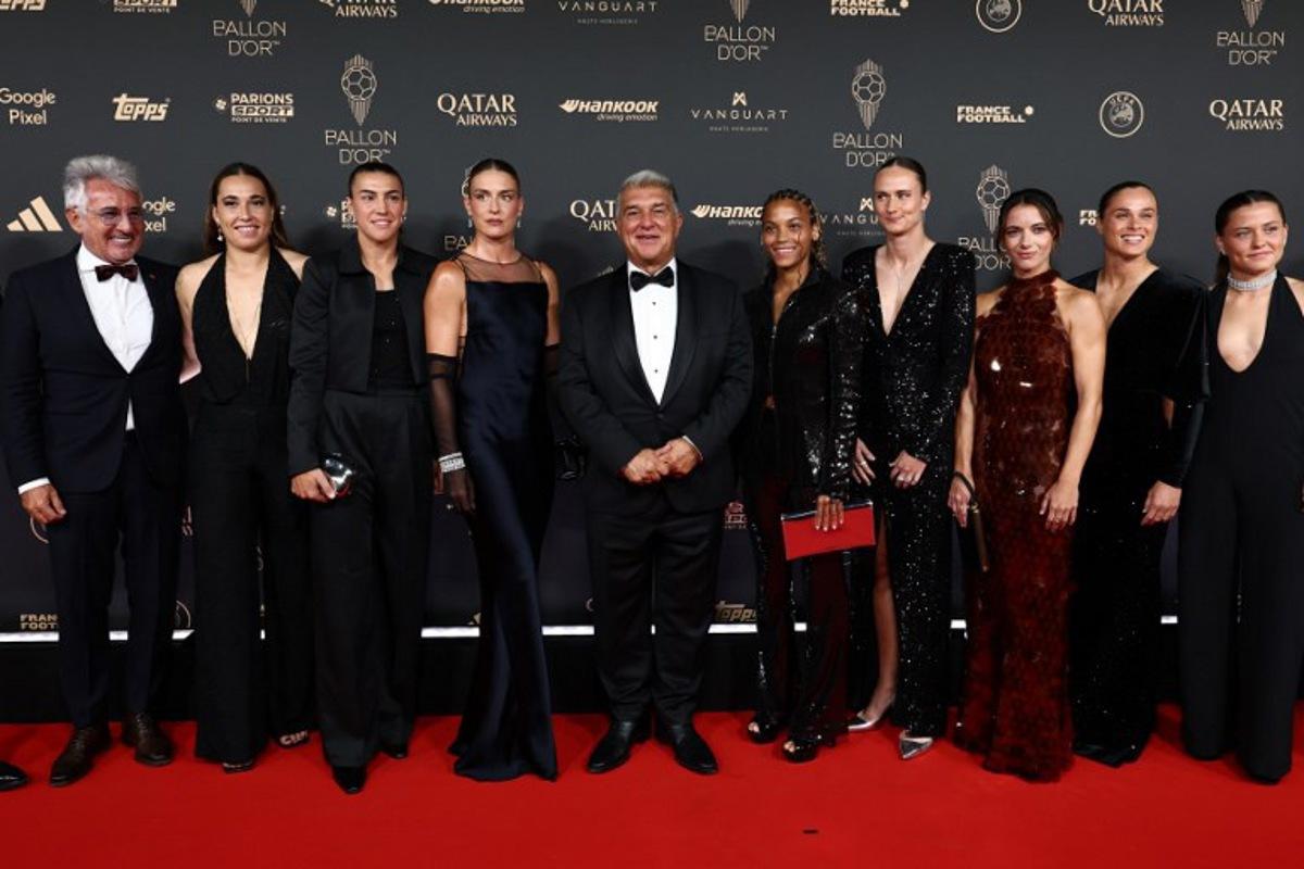 FC Barcelona's President Joan Laporta (C) poses with Barcelona's Spanish midfielder and Ballon d'Or 2024 winner Aitana Bonmati (5thL) and Barcelona's players Laia Aleixandri (3rdL), Cata Coll (2ndL), Vicky (5thR), Caroline Graham (4thL), Patricia Guijarro (3rdL) and Ewa Pajor (2ndR) upon arrival before the 2025 Ballon d'Or France Football award ceremony at the Theatre du Chatelet in Paris on September 22, 2025  FRANCK FIFE / AFP