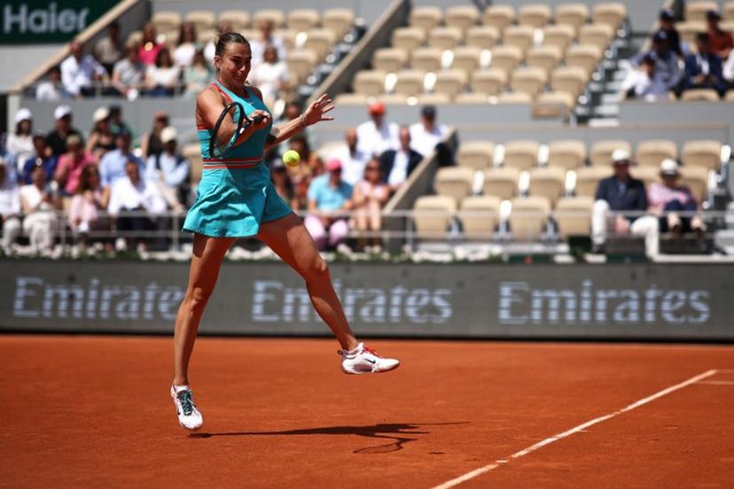 Belarus' Aryna Sabalenka plays a forehand return to China's Zheng Qinwen during their quarter-final women's singles match on day 10 of the French Open tennis tournament on Court Philippe-Chatrier at the Roland-Garros Complex in Paris on June 3, 2025.  Anne-Christine POUJOULAT / AFP