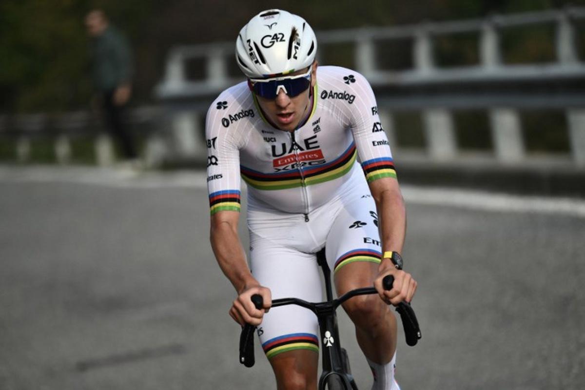 UAE Team Emirates's Slovenian rider Tadej Pogacar attacks to take the lead, in the Passo Di Ganda ascent during the 119th edition of the Giro di Lombardia (Tour of Lombardy), a 238km cycling race from Como to Bergamo on October 11, 2025.  Marco BERTORELLO / AFP