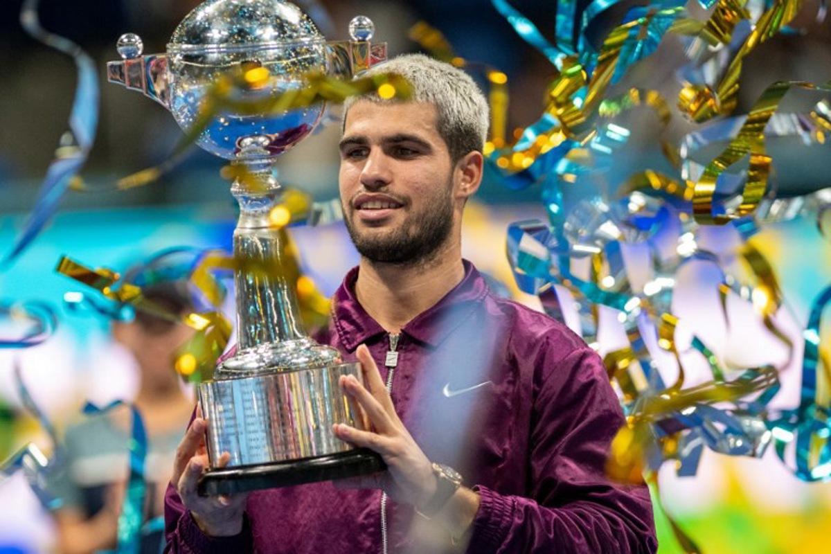 Spain's Carlos Alcaraz celebrates during the award ceremony after winning the men's singles final match against USA's Taylor Fritz at the ATP Japan Open tennis tournament in Tokyo on September 30, 2025.  Philip FONG / AFP