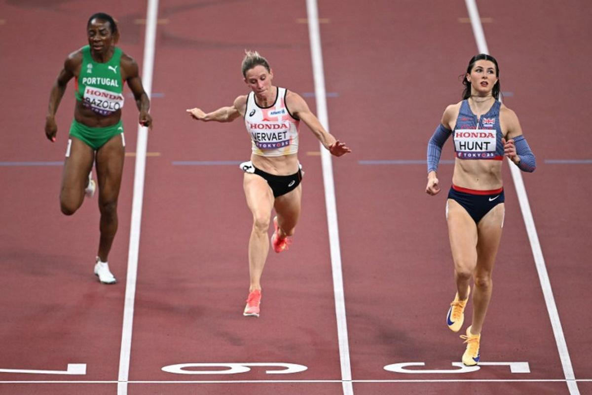 (From L) Portugal's Lorene Dorcas Bazolo, Belgium's Imke Vervaet and Great Britain's Amy Hunt run to the finish line in the women's 200m heats during the World Athletics Championships in Tokyo on September 17, 2025.  Philip FONG / AFP