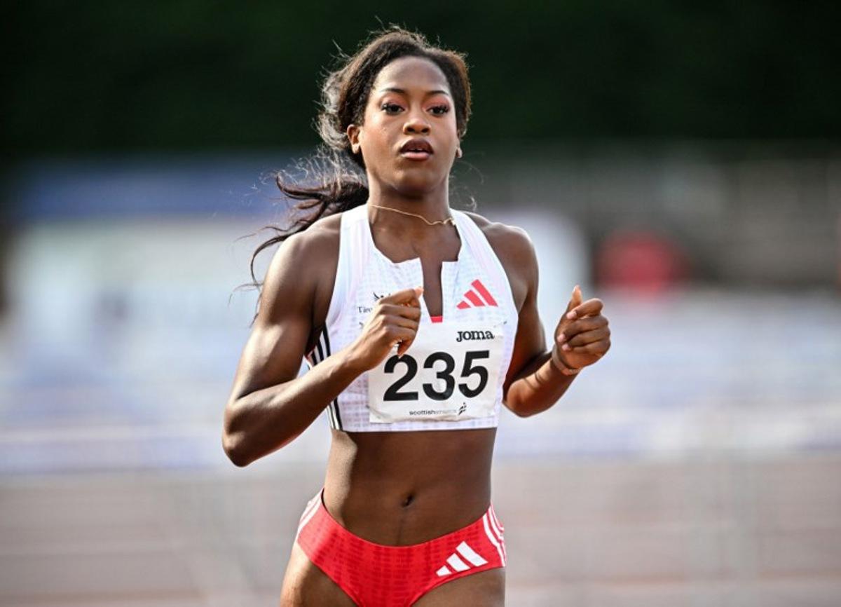 France's Cyrena Samba-Mayela reacts after competing to take fourth place in Women's 100m hurdles final at the Scottish Athletics Championships at Grangemouth Stadium, in Grangemouth, Scotland on August 24, 2025.   Andy Buchanan / AFP