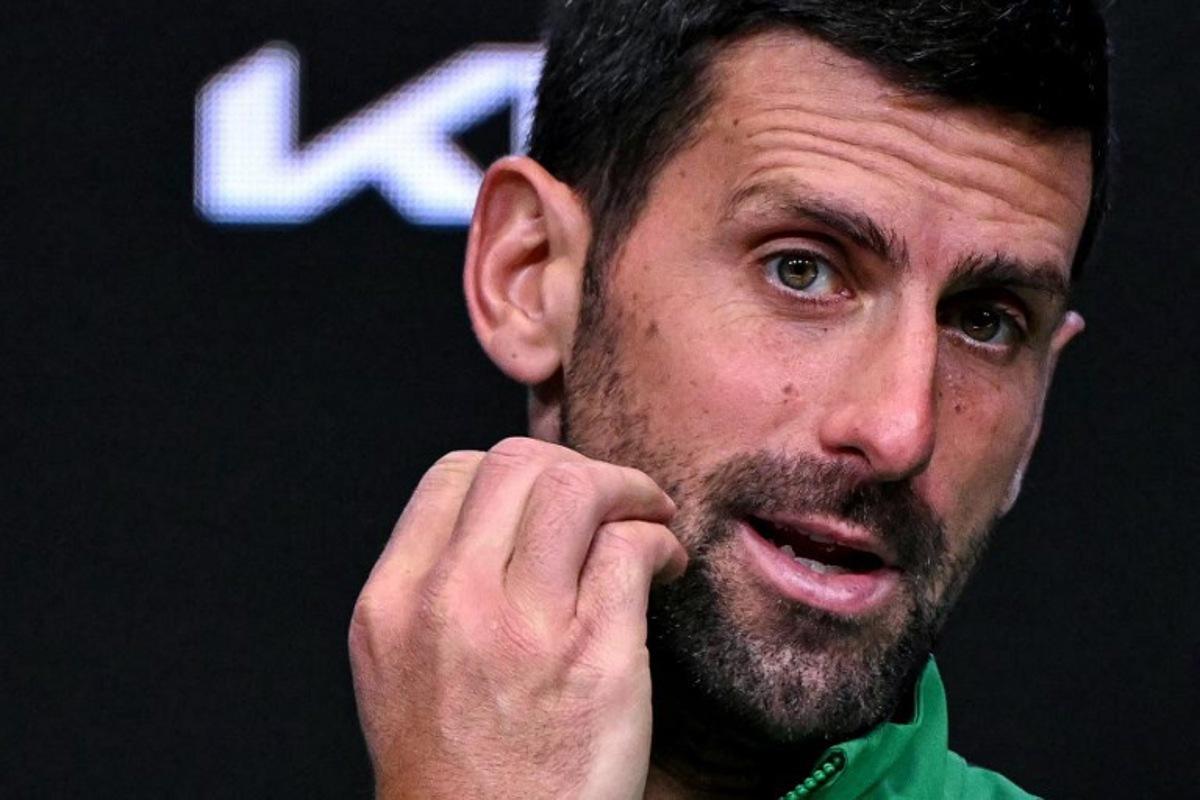 Serbia's Novak Djokovic speaks during a press conference after his defeat against Spain's Carlos Alcaraz in their men's singles final match on day fifteen of the Australian Open tennis tournament in Melbourne on February 1, 2026.  WILLIAM WEST / AFP