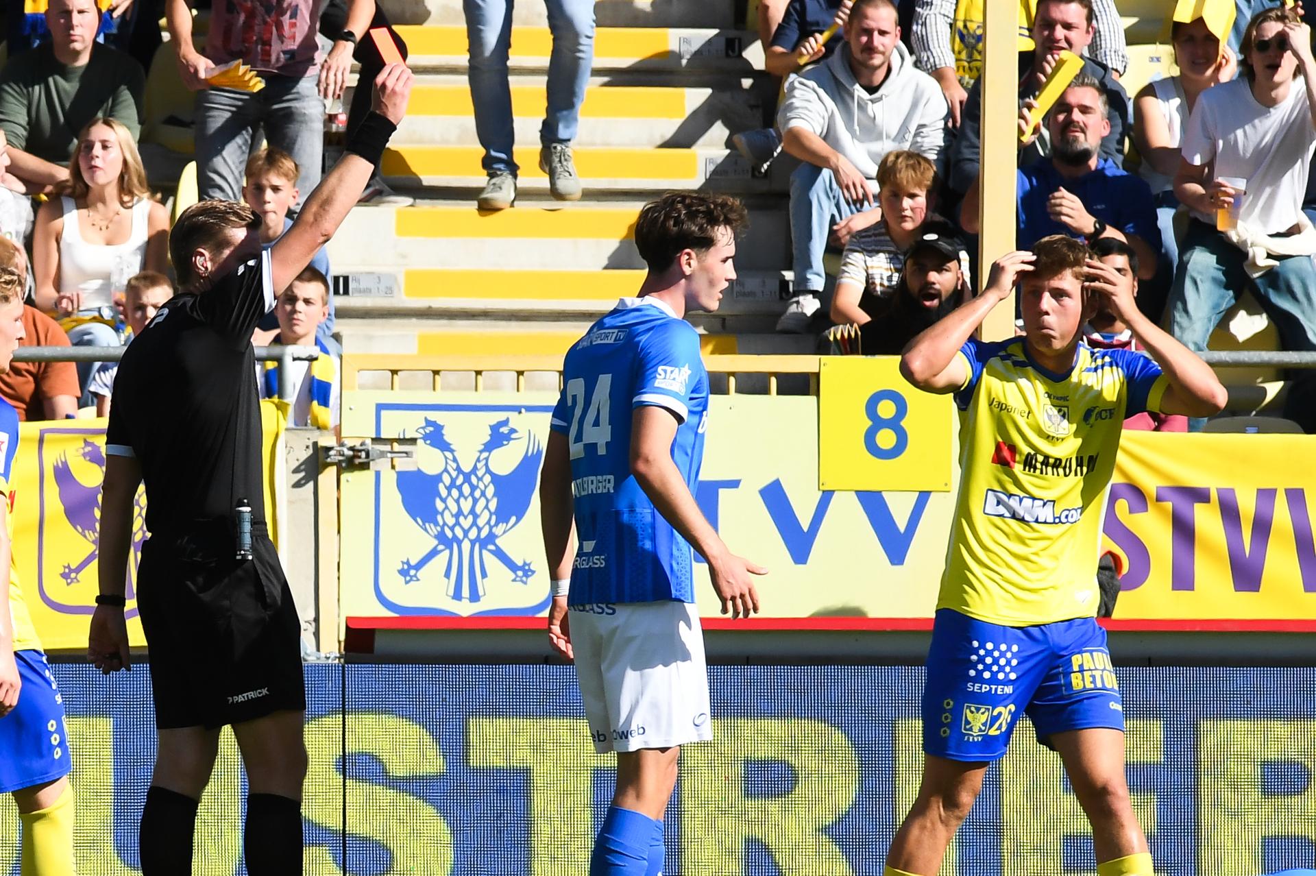 STVV's Rein Van Helden receives a red card from, referee Lawrence Visser and during a soccer match between Sint-Truidense V.V. and KRC Genk, Sunday 28 September 2025 in Sint-Truiden, on day 9 of the 2025-2026 'Jupiler Pro League' first division of the Belgian championship. BELGA PHOTO JILL DELSAUX