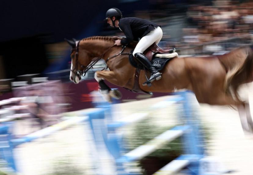 Belgium's Pieter Devos riding Jade V Bisschop competes during the "Le Saut Hermes CSI 5*" International Jumping Competition at the Grand Palais Ephemere in Paris, on March 16, 2024.  FRANCK FIFE / AFP