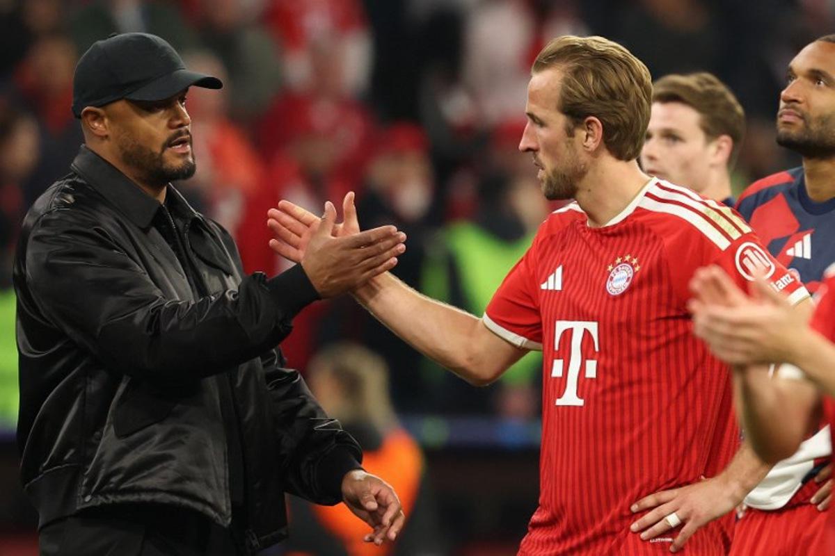 Bayern Munich's Belgian head coach Vincent Kompany (L) shake hands with his players including Bayern Munich's English forward #09 Harry Kane after the UEFA Champions League second-leg, semi-final football match between FC Bayern Munich and Paris Saint-Germain (PSG) in Munich, southern Germany on May 6, 2026.  Odd ANDERSEN / AFP