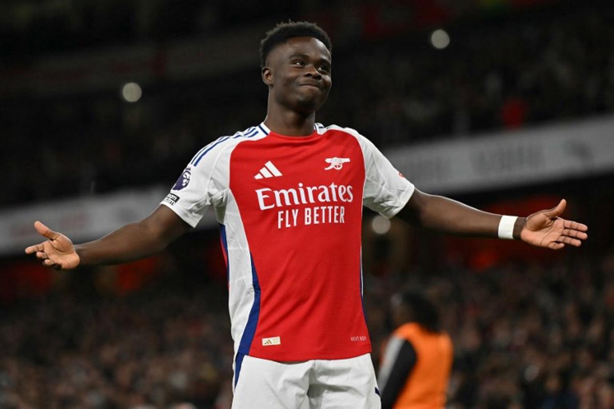 Arsenal's English midfielder #07 Bukayo Saka celebrates scoring the team's second goal during the English Premier League football match between Arsenal and Fulham at the Emirates Stadium in London on April 1, 2025.   Glyn KIRK / AFP