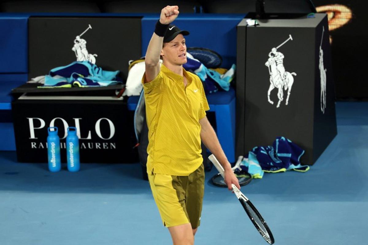 Italy's Jannik Sinner celebrates victory over USA's Eliot Spizzirri after their men's singles match on day seven of the Australian Open tennis tournament in Melbourne on January 24, 2026.  Martin KEEP / AFP