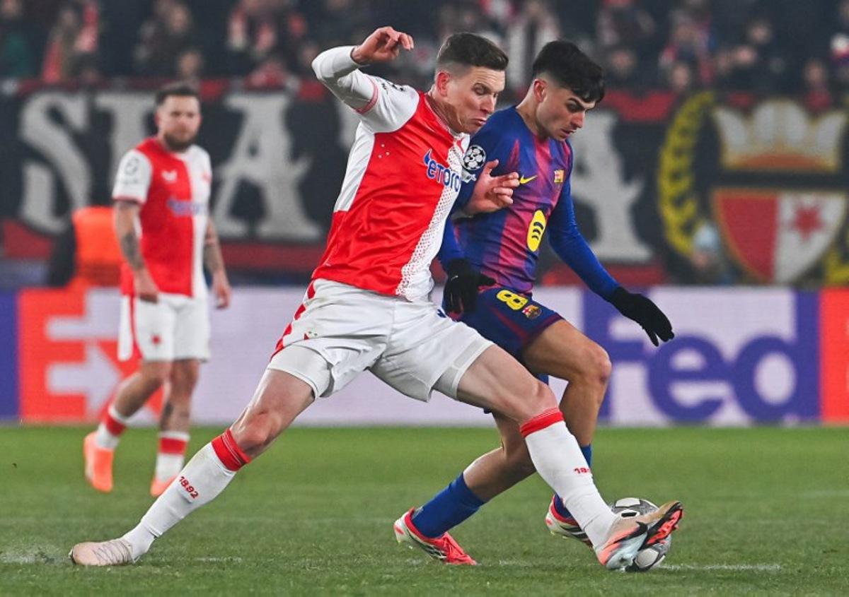 Barcelona's Spanish midfielder #08 Pedri (R) vies for the ball during in the UEFA Champions League football match between Slavia Prague (CZE) and FC Barcelona (ESP) in Prague, Czech Republic on January  21, 2026.  Michal Cizek / AFP