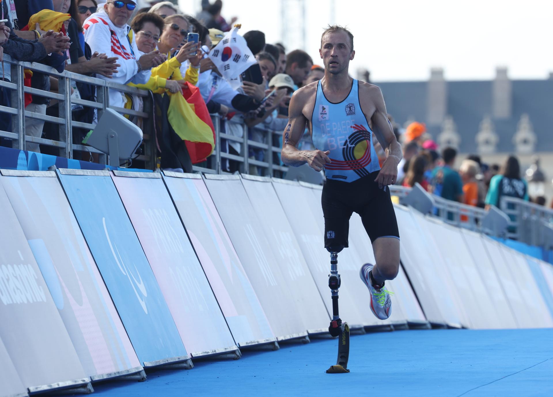 Belgian Wim De Paepe crosses the finish line at the Men Individual PTS2 triathlon event, on day 6 of the 2024 Summer Paralympic Games in Paris, France on Monday 02 September 2024. The 17th Paralympics are taking place from 28 August to 8 September 2024 in Paris. BELGA PHOTO VIRGINIE LEFOUR