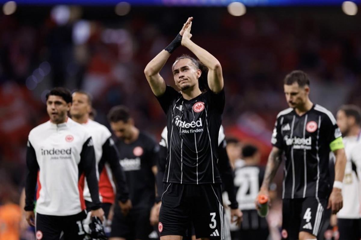 Eintracht Frankfurt's Belgian defender #03 Arthur Theate (C) acknowledges supporters after the UEFA Champions League, league Phase - matchday 2 football match between Club Atletico de Madrid and Eintracht Frankfurt at the Metropolitano stadium in Madrid on September 30, 2025.  Oscar DEL POZO / AFP