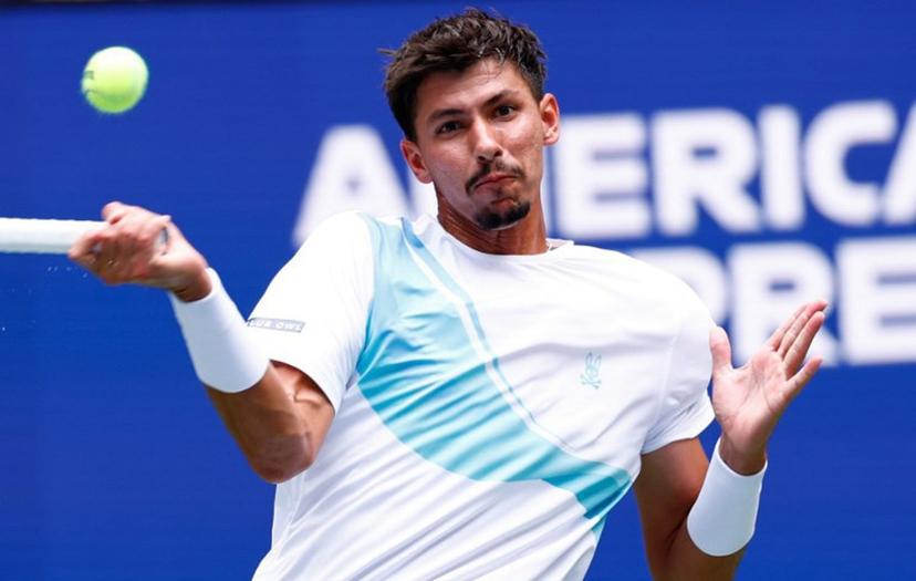 Australia's Alexei Popyrin plays a forehand return to Italy's Jannik Sinner during their men's singles second round tennis match on day five of the US Open tennis tournament at the USTA Billie Jean King National Tennis Center in New York City, on August 28, 2025.  Kena Betancur / AFP