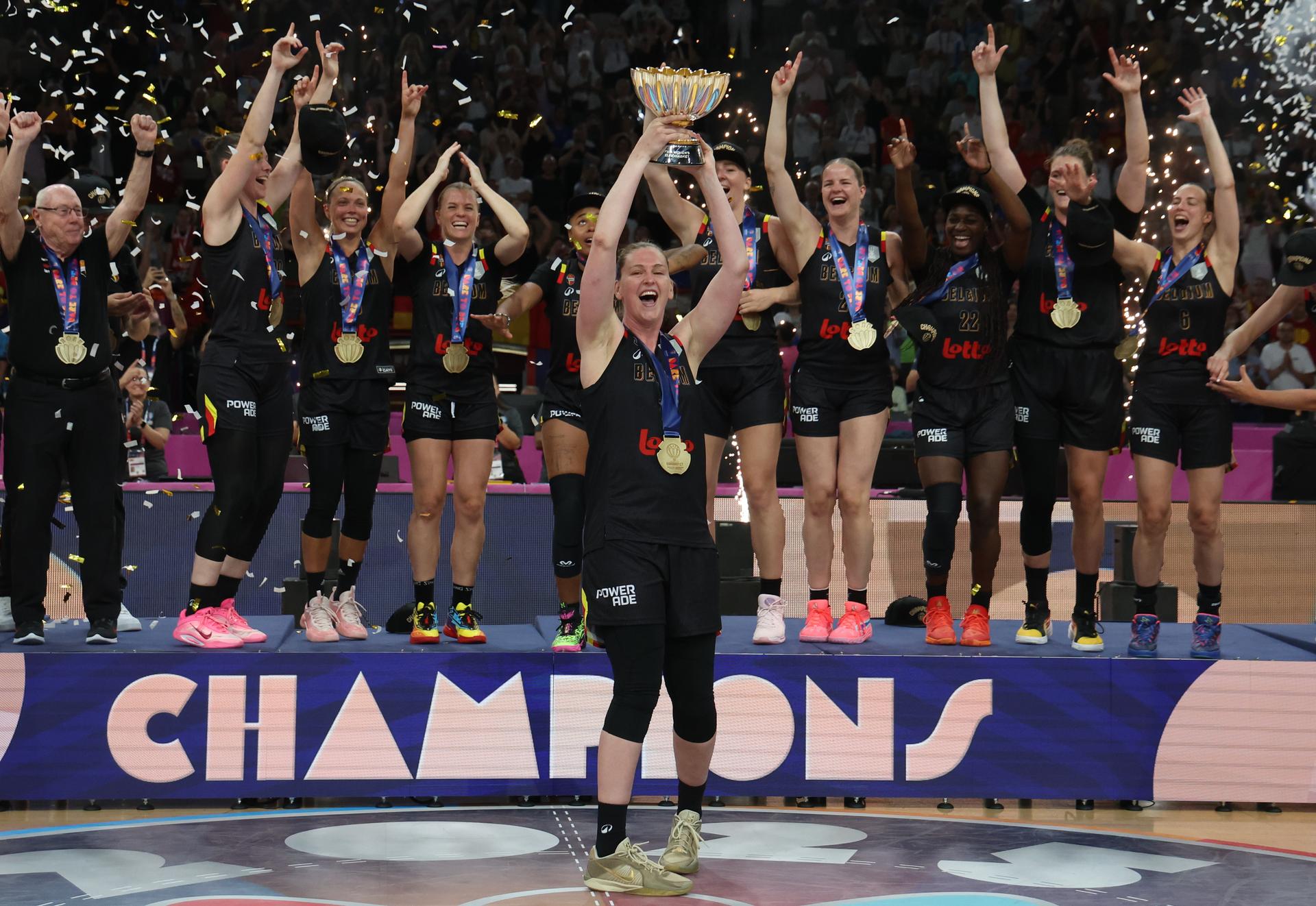 Belgian Cats' players celebrate on the podium after winning a basketball match between Spain and Belgian national team 'the Belgian Cats' on Sunday 29 June 2025 in Piraeus, Greece, the final of the FIBA Women's EuroBasket 2025. BELGA PHOTO VIRGINIE LEFOUR