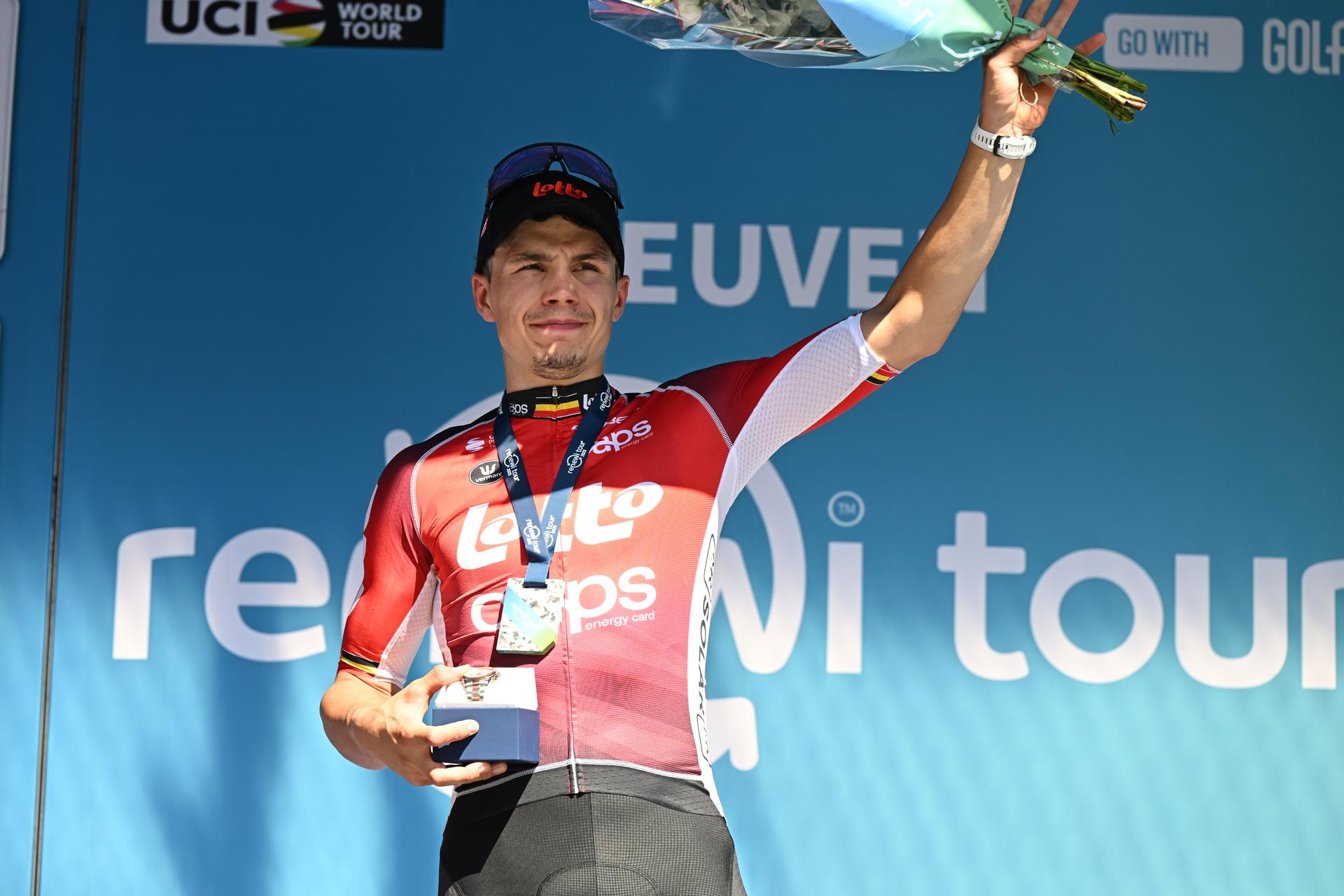 Belgian Arnaud De Lie of Lotto Cycling Team celebrates on the podium after winning the fifth and last stage of the 'Renewi Tour' multi-stage cycling race, 185km from and to Leuven on Sunday 24 August 2025. The five-day race takes place in Belgium and the Netherlands.  BELGA PHOTO DAVID PINTENS