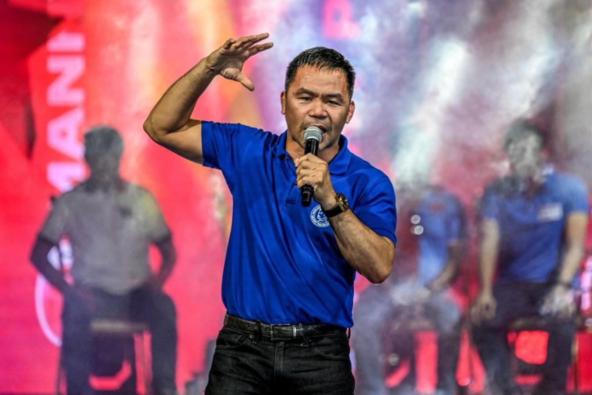 Philippine senatorial candidate Manny Pacquiao attends the campaign rally of senatorial candidates under the party of the Philippines' president Ferdinand Marcos Jr in Mandaluyong, Metro Manila, on May 9, 2025, ahead of the midterm elections. The Philippines votes on May 12 in a ballot that will decide half the Senate's seats, thousands of local posts, and quite possibly the political future of impeached Vice President Sara Duterte. But it is the vice president's feud with President Ferdinand Marcos that has dominated national politics heading into the mid-term election. Jam STA ROSA / AFP