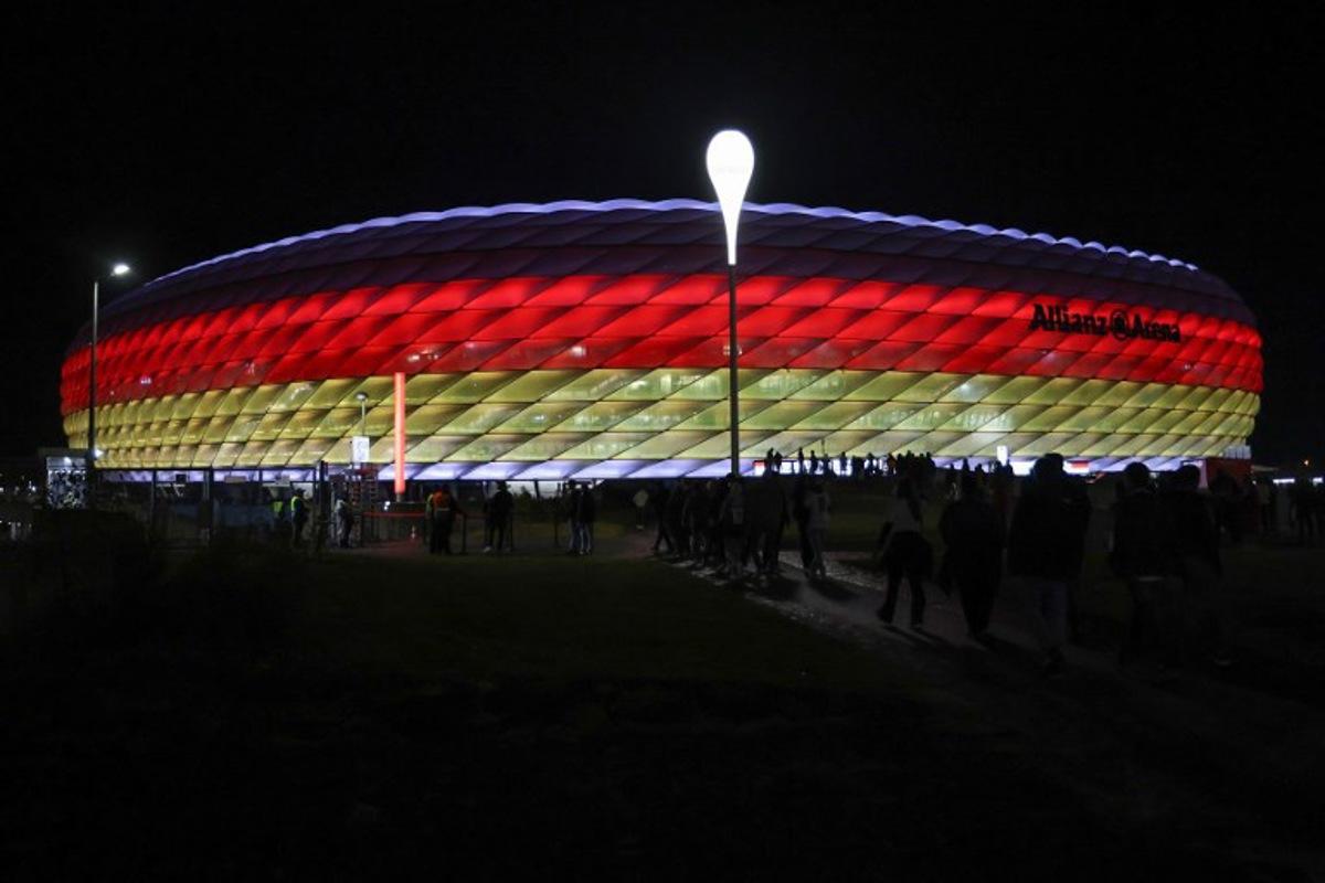 The Allianz Arena is illuminated in the German colours as fans arrive prior to the UEFA Nations League, League A Group A3 football match between Germany and the Netherlands in Munich, southern Germany on October 14, 2024.  Alexandra BEIER / AFP
