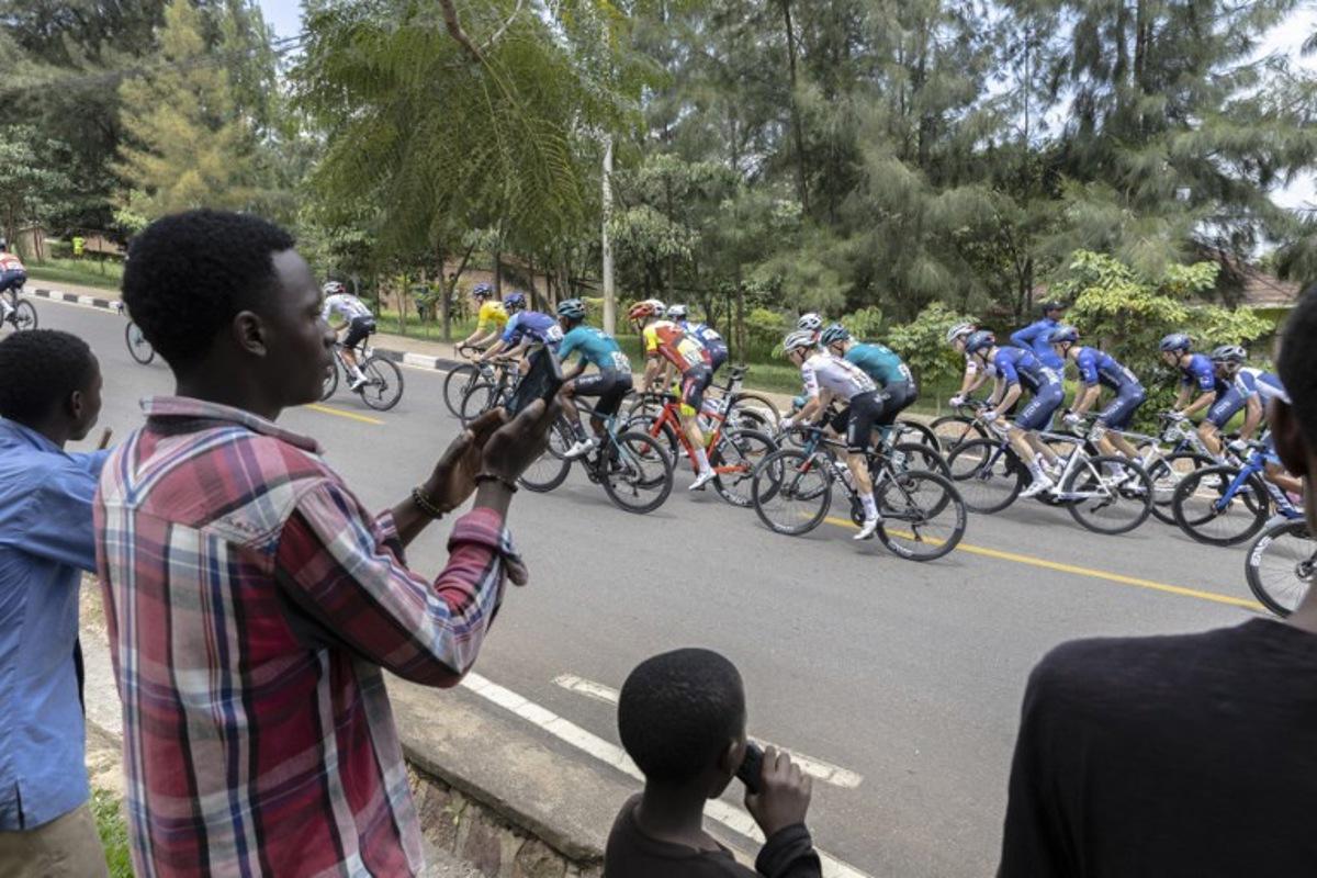 The pack rides during the last stage of the 16th Tour du Rwanda in Kigali on February 25, 2024.  Guillem Sartorio / AFP