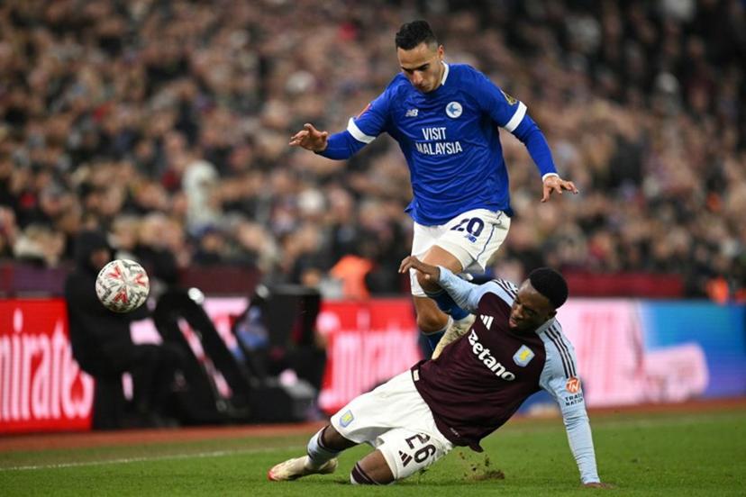 Cardiff City's Dutch striker #20 Anwar El Ghazi battles for the ball with Aston Villa's Dutch midfielder #26 Lamare Bogarde during the English FA Cup fifth round football match between Aston Villa and Cardiff City at Villa Park in Birmingham, central England on February 28, 2025.  Oli SCARFF / AFP