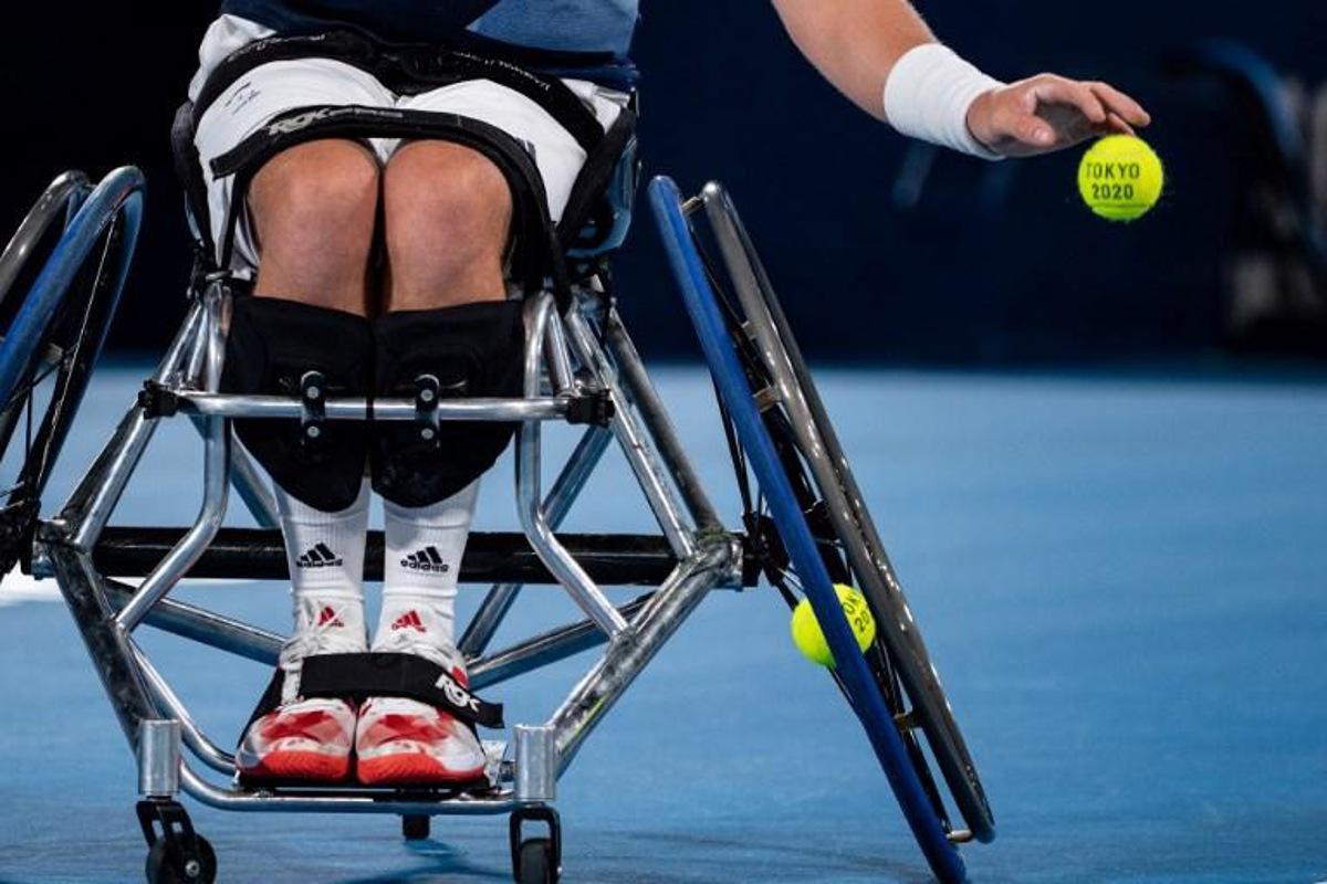 Britain's Alfie Hewett prepares to serve against France's Nicolas Peifer and Stephane Houdet during their men's doubles gold medal match at the Tokyo 2020 Paralympic Games at Ariake Tennis Park in Tokyo on September 3, 2021.  Philip FONG / AFP