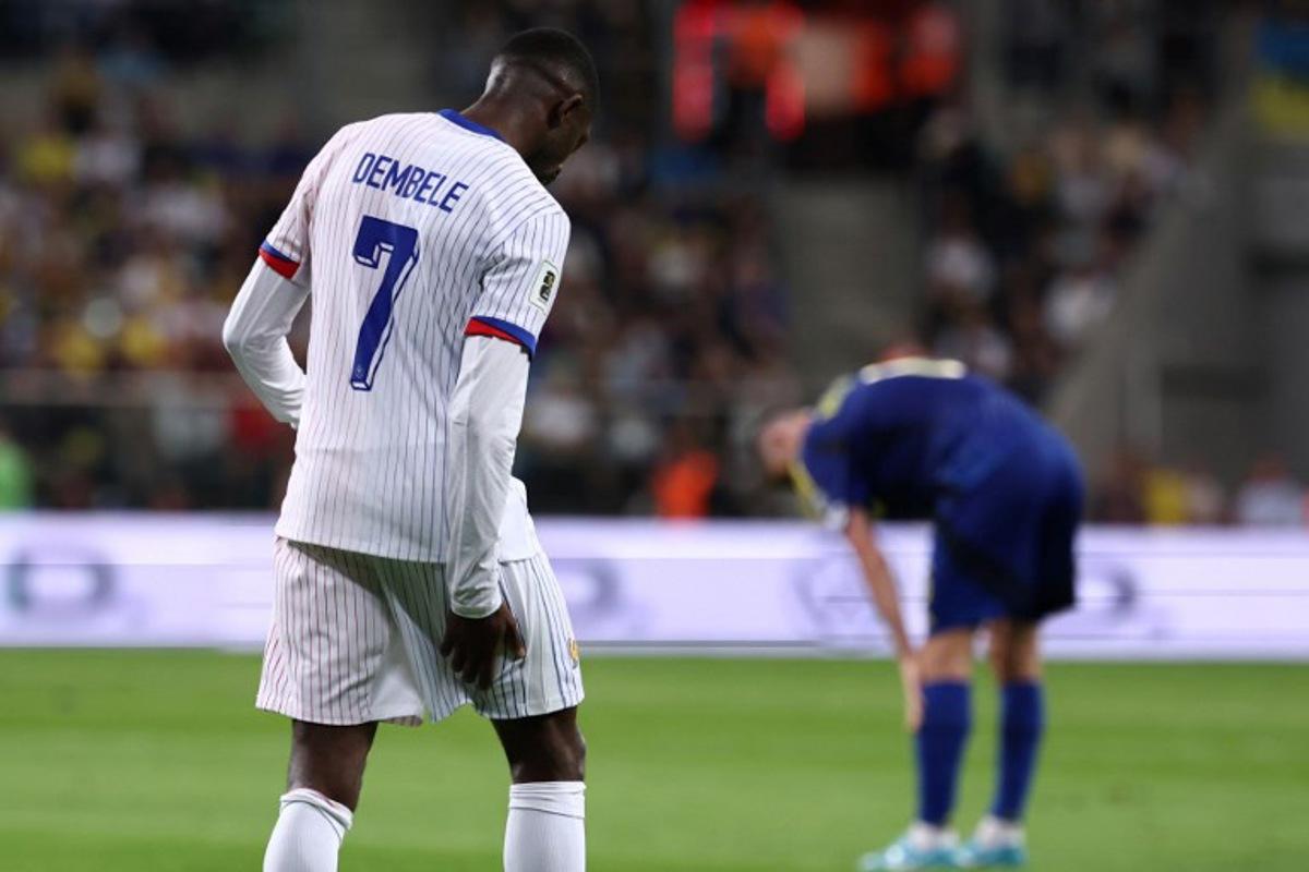 France's forward #07 Ousmane Dembele reacts after an injury during the 2026 World Cup qualifiers Europe zone group D football match between Ukraine and France, in Wroclaw, Poland, on September 5, 2025. The forward of the French national team and Paris Saint-Germain, Ousmane Dembélé, will be out "six to eight weeks" due to a muscle injury in his right thigh, AFP learned on September 6, 2025, from a source close to the player. FRANCK FIFE / AFP