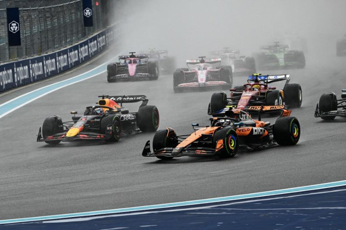 (L-R) Red Bull Racing's Dutch driver Max Verstappen and McLaren's British driver Lando Norris race during the 2025 Miami Formula One Sprint at Miami International Autodrome in Miami Gardens, Florida, on May 3, 2025.   Chandan Khanna / AFP