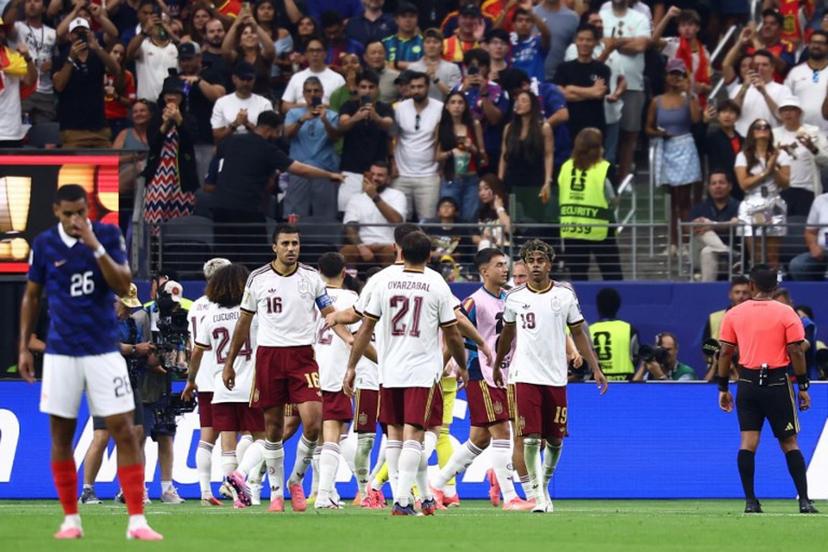 Spain's players celebrate after defender #12 Pedro Porro (unseen) scores his team's second goal during the 2026 World Cup football tournament semi-final match between France and Spain at the Dallas Stadium in Arlington on July 14, 2026.   CHARLY TRIBALLEAU / AFP