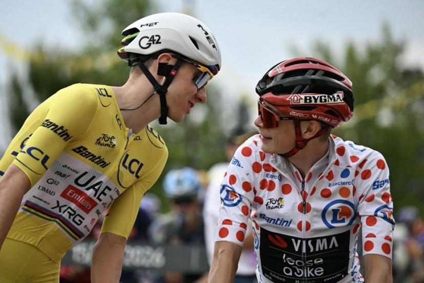 UAE Team Emirates - XRG's Slovenian rider Tadej Pogacar wearing the overall leader's yellow jersey speaks with Team Visma | Lease a Bike's Danish rider Jonas Vingegaard wearing the climber's dotted "King of the Mountains" jersey at the start of the 11th stage of the 113th edition of the Tour de France cycling race, 161,3 km between Vichy and Nevers in central France, on July 15, 2026.  Jeff PACHOUD / AFP