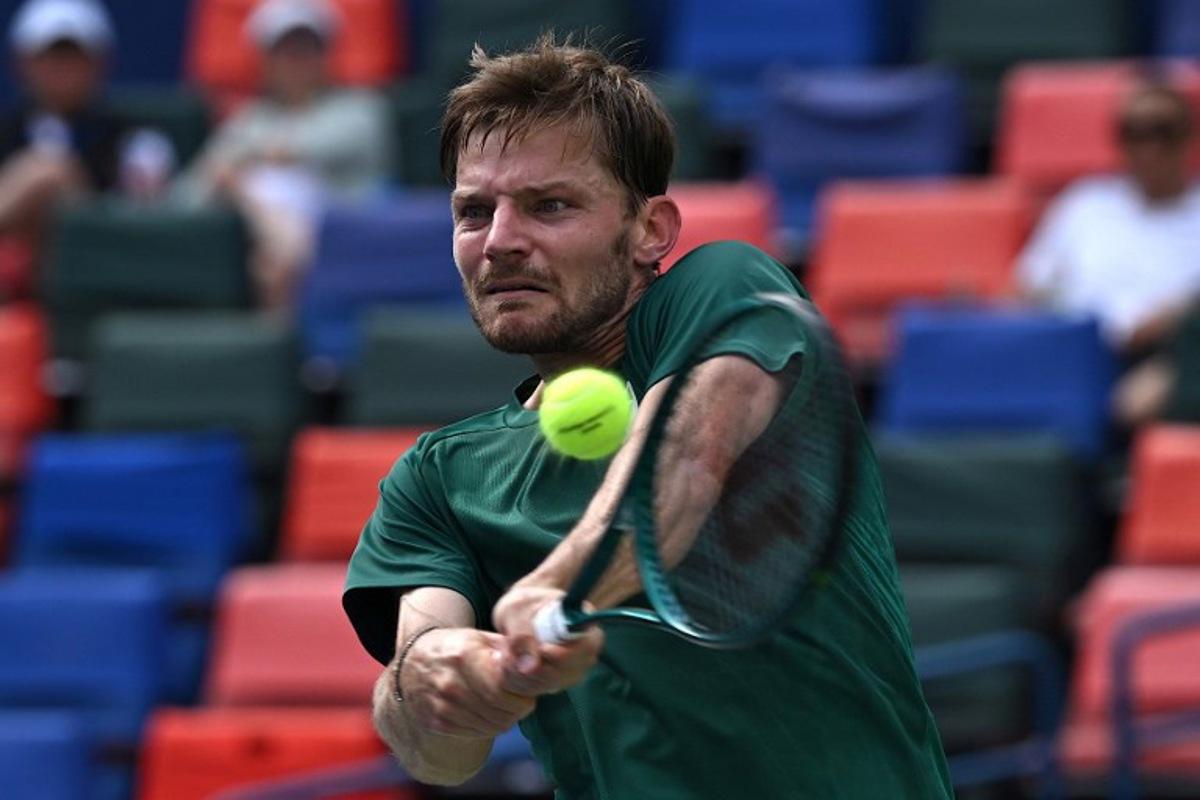 Belgium's David Goffin hits a return to France's Alexandre Muller during their men's singles match at the Shanghai Masters tennis tournament in Shanghai on October 1, 2025.  Jade Gao / AFP