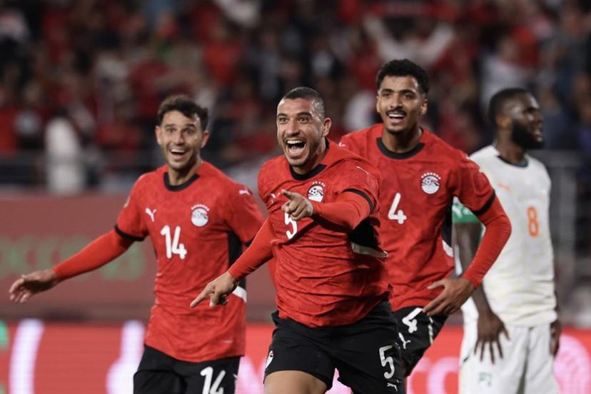 Egypt's defender #5 Ramy Rabia celebrates his goal with Egypt's midfielder #14 Hamdy Fathy and Egypt's defender #4 Hossam Abdelmaguid during the Africa Cup of Nations (CAN) quarter-final football match between Egypt and Ivory Coast at the Grand stadium in Agadir on January 10, 2026.   FRANCK FIFE / AFP
