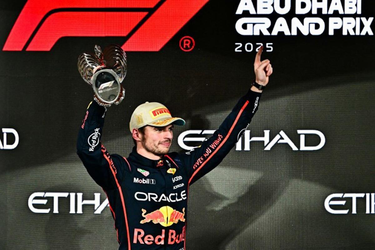 Race winner Red Bull Racing's Dutch driver Max Verstappen celebrates on the podium at the end of the Abu Dhabi Formula One Grand Prix at the Yas Marina Circuit in Abu Dhabi on December 7, 2025.  Giuseppe CACACE / AFP