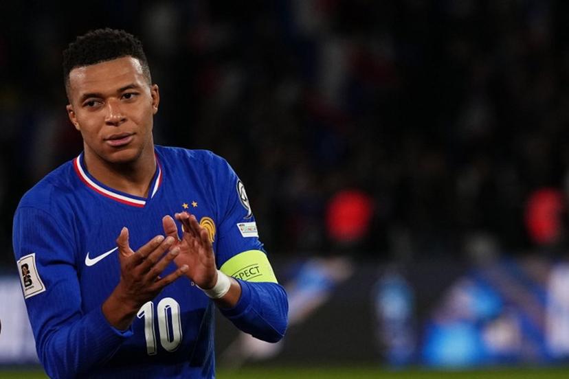France's forward #10 Kylian Mbappe applauds at the end of the 2026 World Cup qualifiers Europe zone group D football match between France and Ukraine at the Parc des Princes stadium in Paris, on November 13, 2025.  France wins 4 - 0 against Ukraine and qualifies foe the 2026 World Cup. Dimitar DILKOFF / AFP