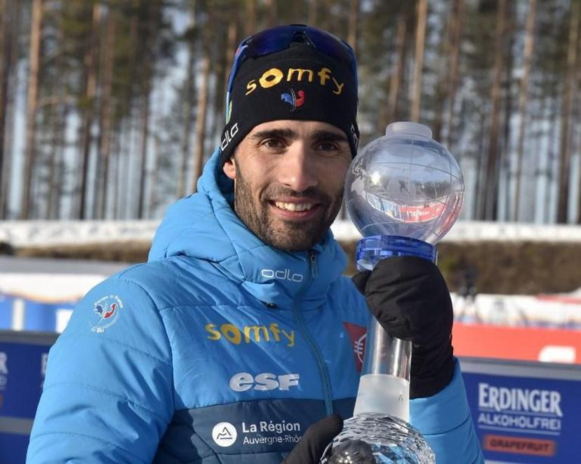 Martin Fourcade of France celebrates with a trophy after the men's 12,5 km Pursuit competition at the IBU Biathlon World Cup in Kontiolahti, Finland, on March 14, 2020. Fourcade ends his career now at the end of the season in Kontiolahti where he took his first World Cup victory exactly 10 years ago on March 14, 2010.  Jussi Nukari / Lehtikuva / AFP Finland OUT

