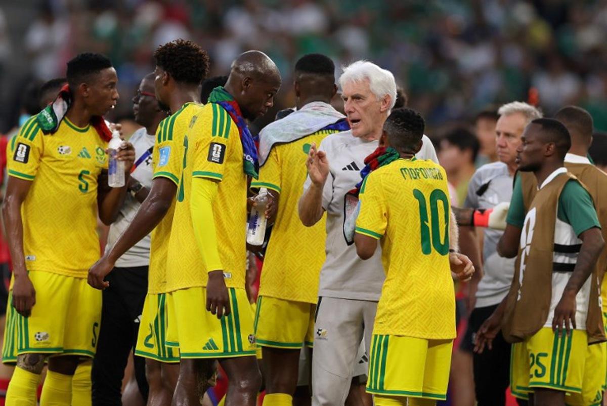 South Africa's Belgian head coach Hugo Broos talks to his players  during a hydration break of the 2026 World Cup Group A football match between South Africa and South Korea at the Monterrey Stadium in Guadalupe, Mexico, on June 24, 2026.   Julio Cesar AGUILAR / AFP