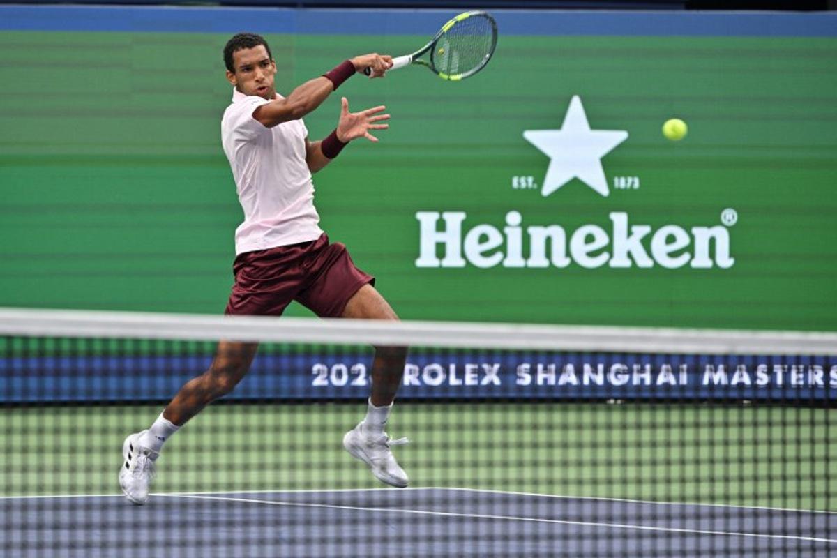 Canada's Felix Auger-Aliassime hits a return to Argentina's Camilo Ugo Carabelli during their men's singles match at the Shanghai Masters tennis tournament in Shanghai on October 10, 2026.  Hector RETAMAL / AFP