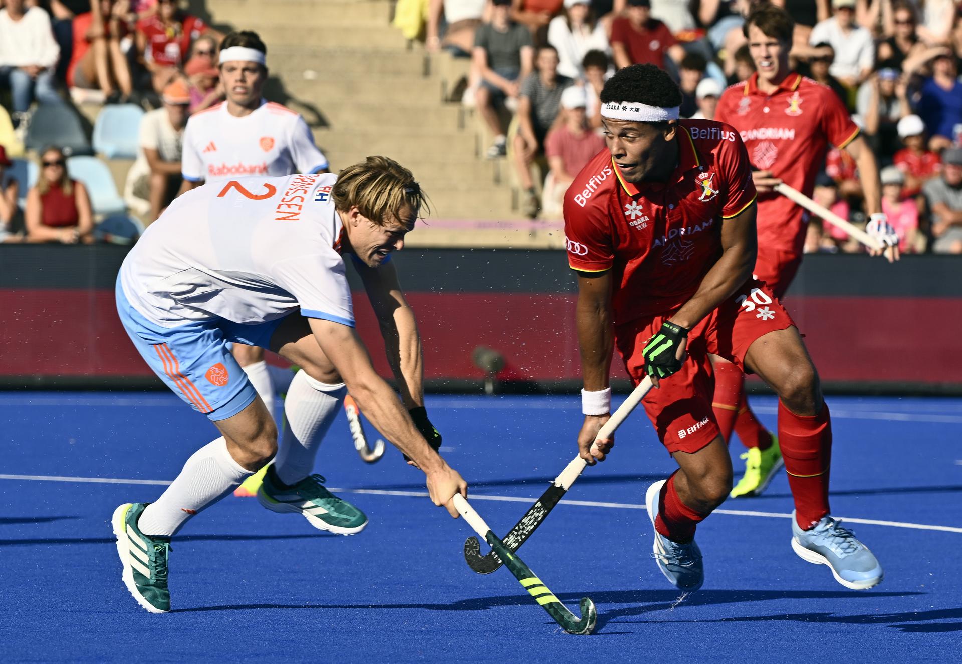 Dutch Jip Janssen and Belgium's Nelson Onana pictured in action during a hockey game between Belgian national team Red Lions and The Netherlands, match 2/3 in the pool stage of the 2025 men's European championships, Sunday 10 August 2025 in Monchengladbach, Germany. BELGA PHOTO ERIC LALMAND