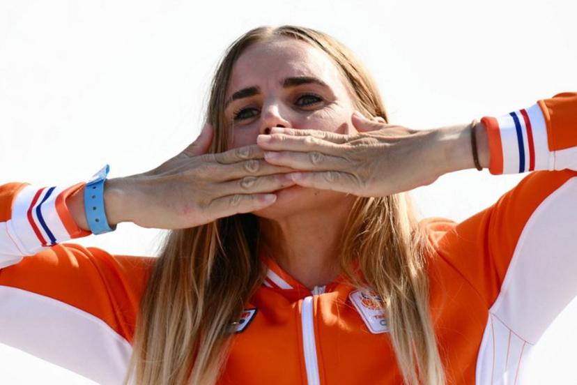 Gold medallist Netherlands' Marit Bouwmeester celebrates on the podium during the award ceremony for the women's ILCA 6 single-handed dinghy event during the Paris 2024 Olympic Games sailing competition at the Roucas-Blanc Marina in Marseille on August 7, 2024.   Christophe SIMON / AFP