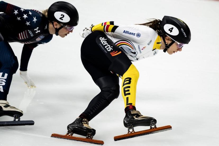 Belgium's Hanne Desmet (R) and US' Kristen Santos-Griswold compete in the Women 1500m Finals during the 2024/2025 ISU Short Track Speed Skating World Cup Milan 2025, part of a Milano Cortina 2026 Winter Olympic Games test event, at the Milano Speed Skating Stadium on February 16, 2025.   MARCO BERTORELLO / AFP