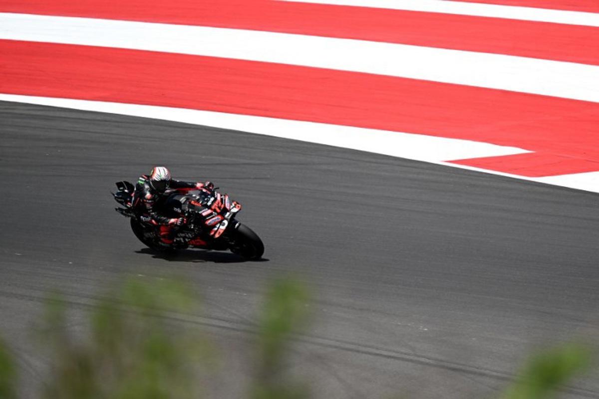 Aprilia Racing team's Italian MotoGP rider Marco Bezzecchi rides during the qualifying session ahead of the MotoGP Indonesian Grand Prix at the Mandalika International Circuit in Mandalika, West Nusa Tenggara on October 4, 2025.  SONNY TUMBELAKA / AFP