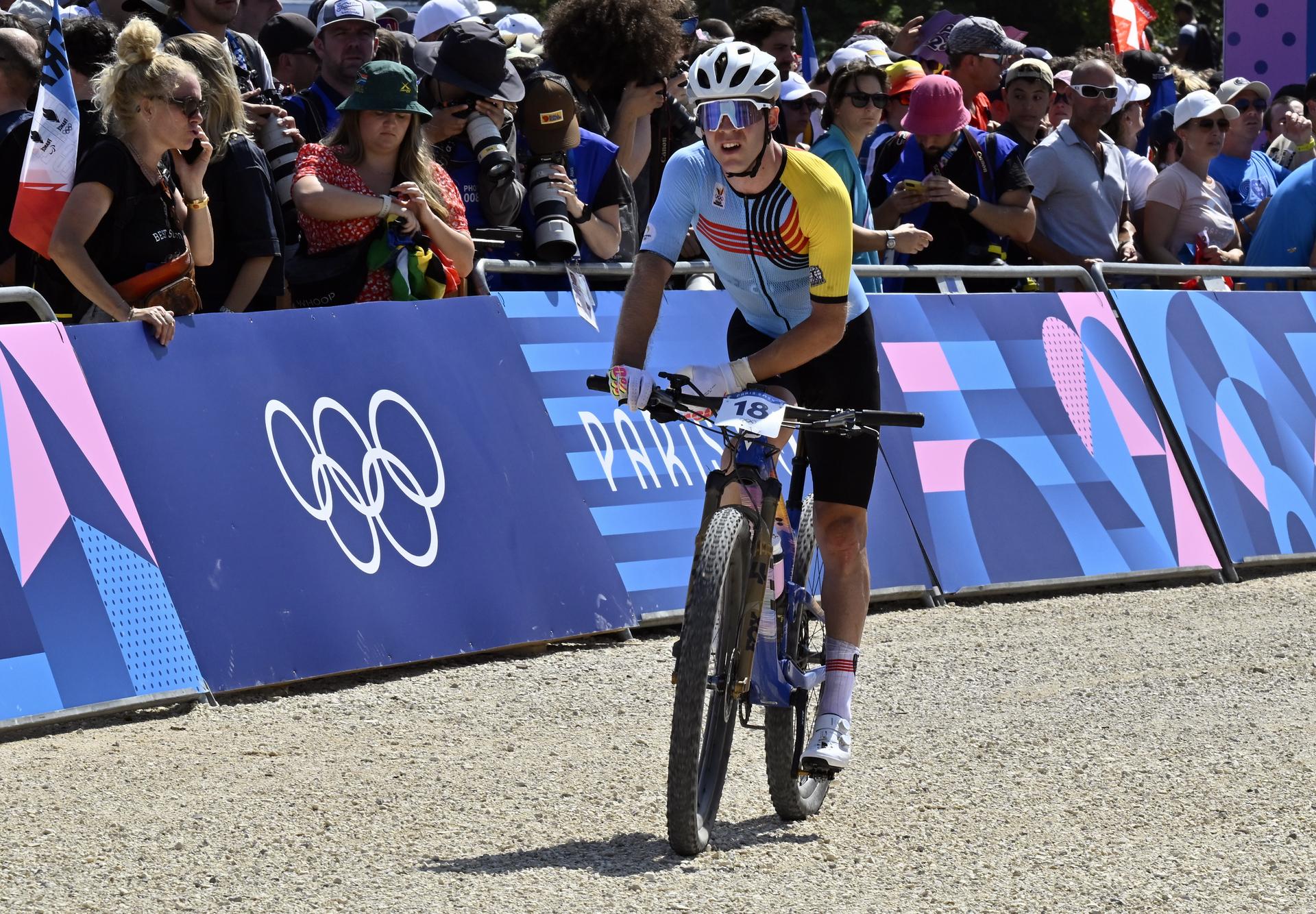 Belgian Jens Schuermans looks dejected after the men's cross-country mountain bike cycling race at the Paris 2024 Olympic Games, at the Colline d'Elancourt climb near Paris, France on Monday 29 July 2024. The Games of the XXXIII Olympiad are taking place in Paris from 26 July to 11 August. The Belgian delegation counts 165 athletes competing in 21 sports. BELGA PHOTO DIRK WAEM