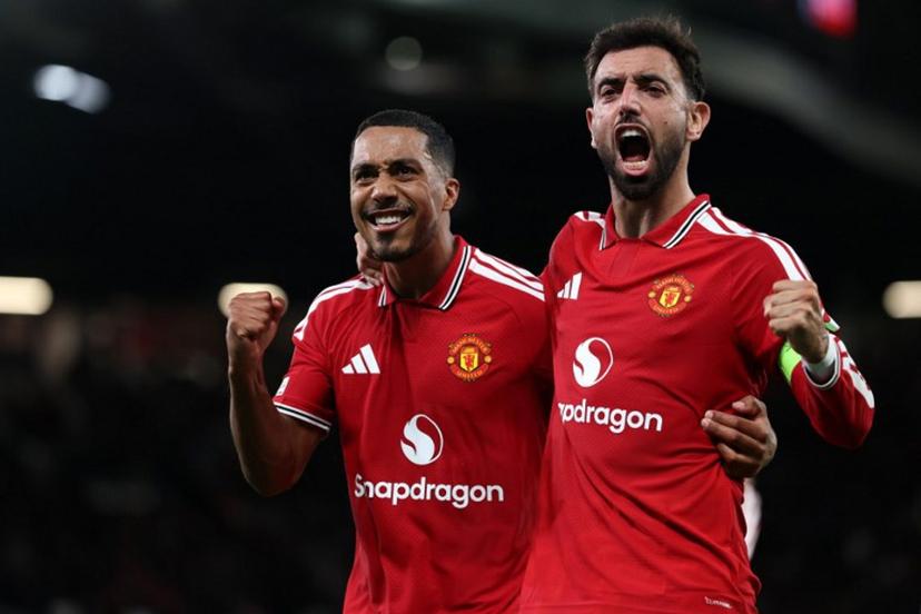 Manchester United's Portuguese midfielder #08 Bruno Fernandes celebrates scoring the team's second goal with Manchester United's Belgian midfielder #18 Youri Tielemans (L) during the UEFA Champions League football match between Manchester United and Sabah FK at Old Trafford in Manchester, north west England, on September 10, 2026.  Darren Staples / AFP