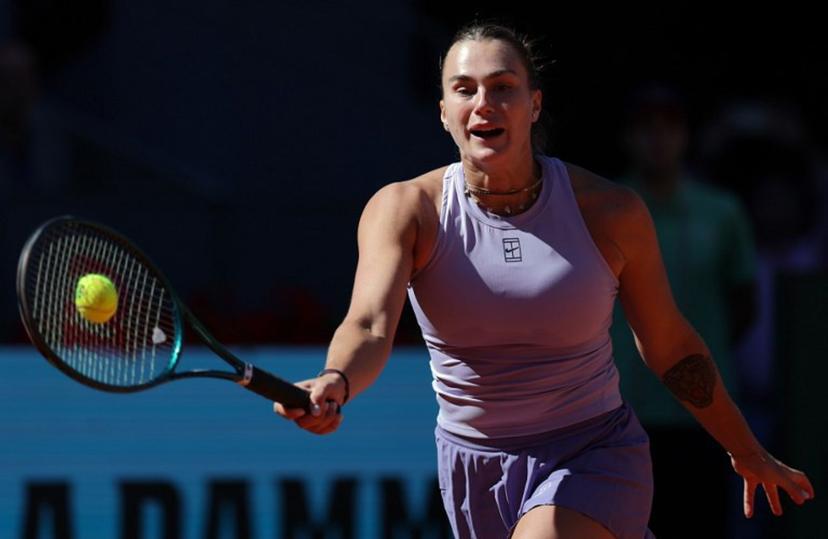 Belarus' Aryna Sabalenka returns the ball to Belgium's Elise Mertens during their 2025 WTA Tour Madrid Open tennis tournament third round singles match at the Caja Magica in Madrid, on April 27, 2025.   Thomas COEX / AFP