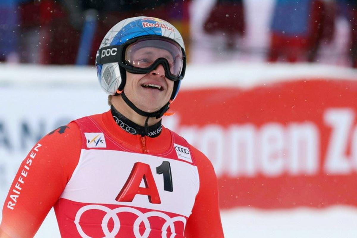 Switzerland's Marco Odermatt celebrates after winning after the men's giant slalom event of the FIS Alpine Skiing World Cup in Soelden, Austria on October 26, 2025.  Johann GRODER / EXPA / APA / AFP