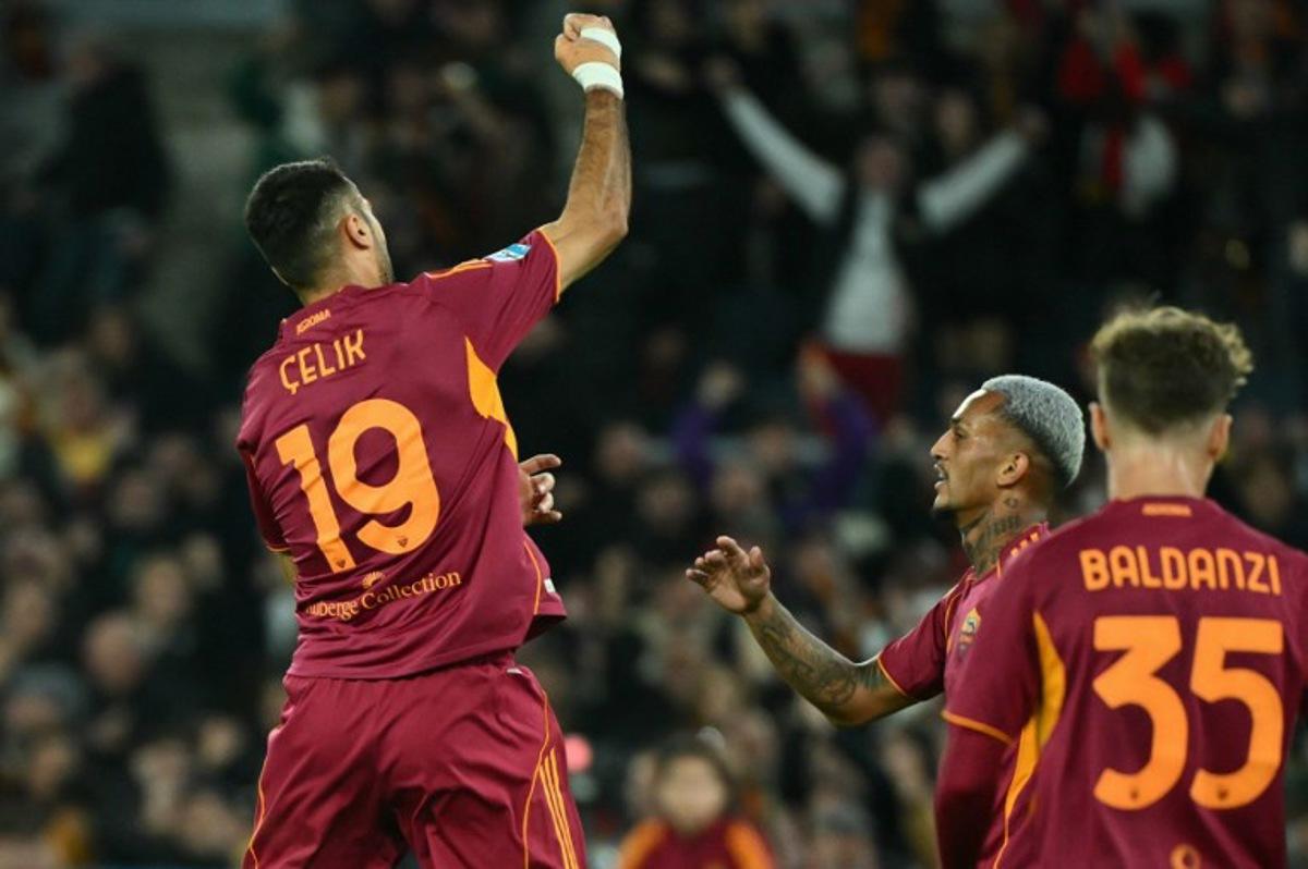 Roma's Turkish defender #19 Zeki Celik celebrates after scoring during the Italian Serie A football match between AS Roma and Udinese at the Olympic Stadium in Rome on November 9, 2025.  Alberto PIZZOLI / AFP
