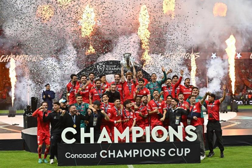 Toluca's midfielder #14 Marcel Ruiz lifts the trophy next to  teammates after winning the CONCACAF Champions Cup final football match between Mexico's Toluca and Tigres UANL at the Nemesio Diaz stadium in Toluca, Mexico on May 30, 2026.  Mario Vazquez / AFP