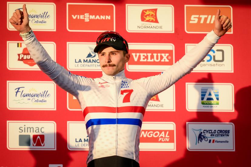 British Cameron Mason pictured on the podium after the men's race at the Cyclocross World Cup cyclocross event in Flamanville, France, Sunday 30 November 2025, the 2nd stage (out of 12) in the World Cup of the 2025-2026 season. BELGA PHOTO DAVID PINTENS