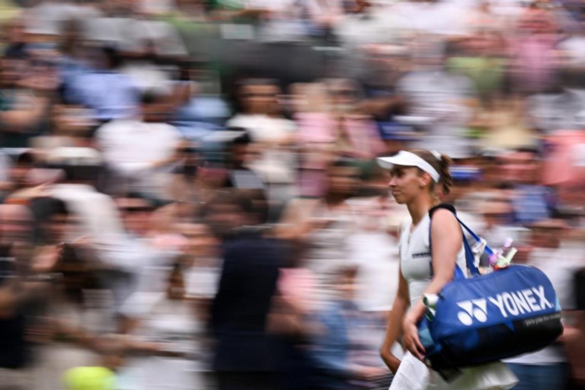 Belgium's Elise Mertens reacts as she leaves the Centre Court following her defeat against Belarus's Aryna Sabalenka during their women's singles fourth round tennis match on the seventh day of the 2025 Wimbledon Championships at The All England Lawn Tennis and Croquet Club in Wimbledon, southwest London, on July 6, 2025.  Kirill KUDRYAVTSEV / AFP