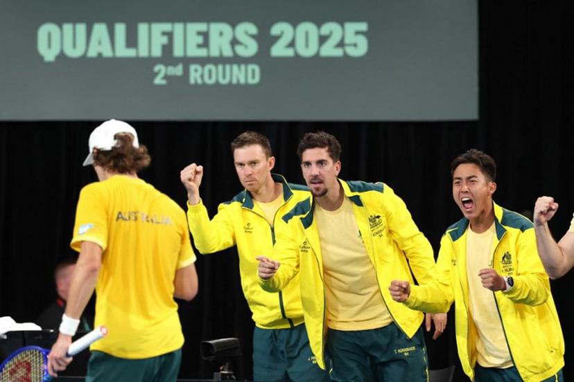 Australia's John Peers (2nd L), Thanasi Kokkinakis and Ricky Hijikata (R) react as they support team mate Alex de Minaur (L) during his match against Belgium's Zizou Bergs during the Davis Cup second-round qualifier tennis match at Ken Rosewall Arena in Sydney on September 14, 2025.  DAVID GRAY / AFP