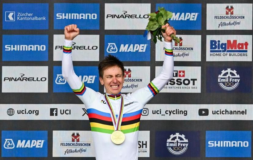 Winner Slovenia's Tadej Pogacar celebrates during the podium ceremony of the men's Elite Road Race cycling event as part of the UCI 2024 Road World Championships, in Zurich, on September 29, 2024.  Fabrice COFFRINI / AFP