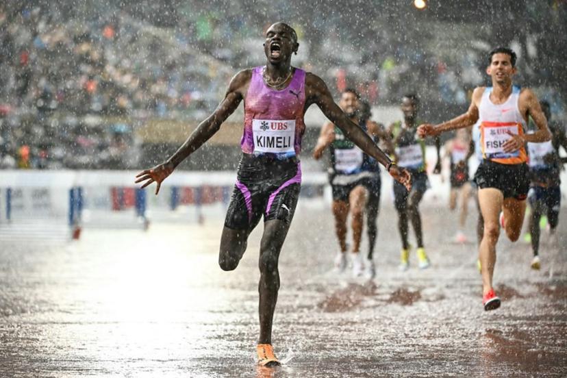 Belgium's Isaac Kimeli celebrates after winning  the men's 5000m event of the IAAF Diamond League athletics meeting "Athletissima" at Stade Olympique de la Pontaise in Lausanne, on August 20, 2025.  Fabrice COFFRINI / AFP